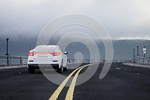 Generic and brandless SUV car on the road with mountain, 3d render