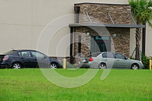 Generic drive thru pickup window with cars