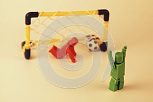 Generic figures recreating a penalty shootout in soccer