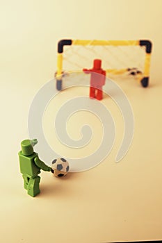 Generic figures recreating a penalty shootout in soccer