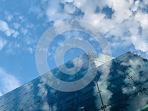 Generic glass building in London with beautiful clear blue sky , modern architecture