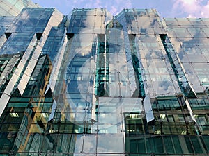 Generic glass building in London with beautiful clear blue sky , modern architecture