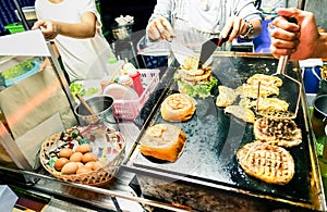 Generic hamburger vendors cooking beef and chicken burgers