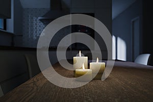 Generic kitchen interior at night with moon light and burning candles