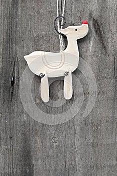 Generic machine made Christmas reindeer ornament on rustic style