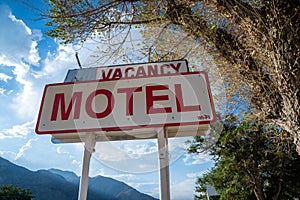 Generic motel sign with vacancy in California on a sunny day