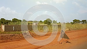 Generic poor house and street sign in Bamako, Mali