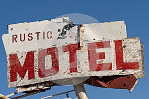 Generic rustic motel sign is decaying and abandoned in California