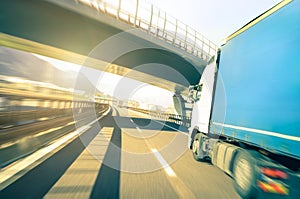 Generic semi truck speeding on highway - Logistic transport concept