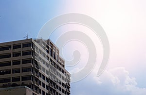 Generic tower or apartment on blue sky background