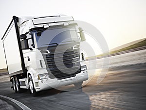 Generic white industrial transport truck traveling down the road with motion blur. Room for copy space.