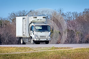 Generic White Refrigerated Delivery Truck On Roadway