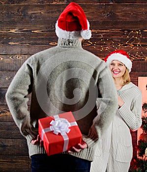 Generosity and kindness. Surprising his wife. Prepare surprise for darling. Winter surprise. Man carry gift box behind