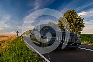 Genesis G90 luxury limousine on the scenic road