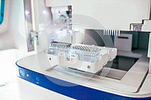 Genetic analyzator machine with blood genetic material samples in bio technological laboatory. DNA test.
