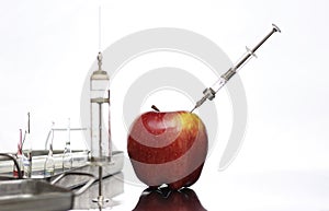 Genetically modified foods, apple pumped with chemicals