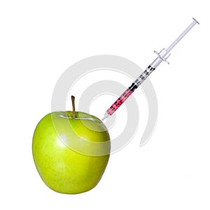 Genetically modified green apple and syringe isolated on white background. GMO food concept