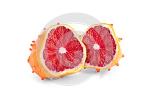 Genetically modified kiwano with red orange on white background