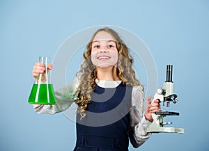 Genetically modified organism. Girl school study chemical liquids. Education concept. School chemistry lesson. School