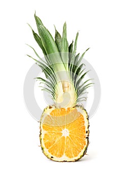 Genetically modified pineapple with orange on white background