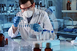 Geneticist holding pcr tubes for genetic analytical in the clinical laboratory