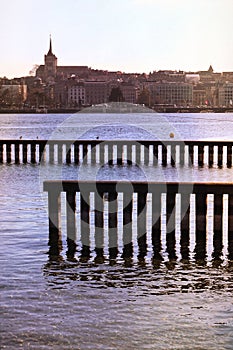 Geneva lakefront docks and cityscape with pier, Switzerland