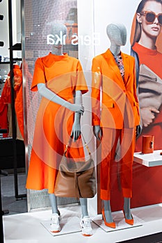 Hugo Boss fashion store, exposition, window shop with modern bags, clothes, shoes from Hugo Boss fashion house