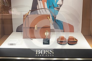 Hugo Boss fashion store, exposition, window shop with modern bags, clothes, shoes from Hugo Boss fashion house