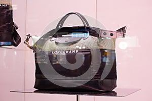 Longchamp fashion store, exposition, window shop with modern bags, clothes,