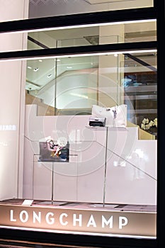 Longchamp fashion store, exposition, window shop with modern bags, clothes,