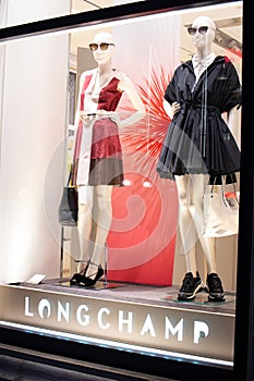 Longchamp fashion store, exposition, window shop with modern bags, clothes,