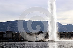 Geneva in winter Water jet deau Water Fountain and mountain Mont Saleve