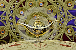 Genie lamp, old oil lamp with Arabic motifs photo