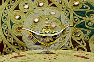 Genie lamp, old oil lamp with Arabic motifs photo