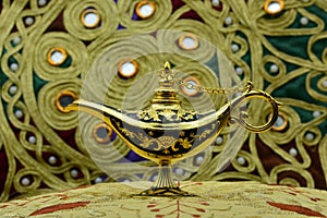 Genie lamp, old oil lamp with Arabic motifs photo