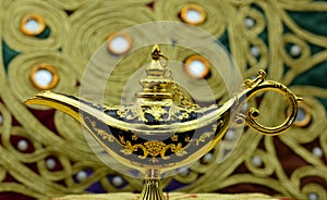 Genie lamp, old oil lamp with Arabic motifs photo