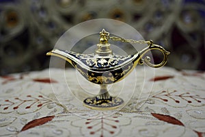 Genie lamp, old oil lamp with Arabic motifs photo