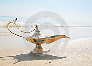 Genies lamp on seashore