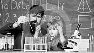 Genius kid. Teacher child test tubes. Chemical experiment. Achieving developmental milestones way before predicted sign