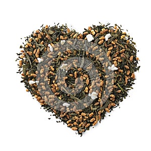 Genmaicha, Japanese tea in heart shape on white background photo
