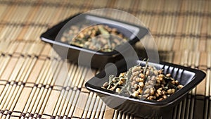 Genmaicha tea in black plate