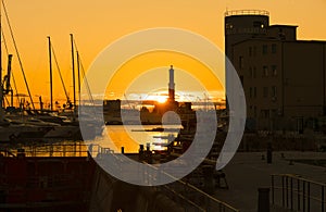 View of Lanterna Lighthouse of Genoa at sunset, Italy