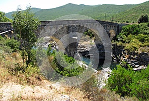 The Genoese bridge with three arches on the Tavignano river, near Altiani, Corsica x