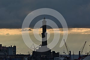 Cloudy sunset at Lanterna, the city lighthouse. Genova. Liguria, Italy photo