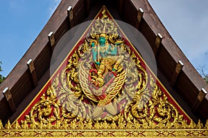 Genreric Thai art sculpture to decorate home, building, temple. Ancient golden carving wooden window of Thai temple. Thailand. tha