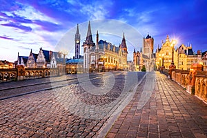 Gent, Belgium. Graslei and bell tower at River Leie, Flanders