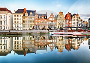 Gent, Belgium. Sunrise in historical center of Ghent with medieval buildings of Korenlei, Graslei and castle of the counts