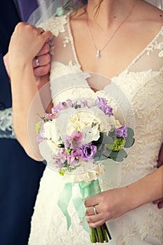 Gentle bridal bouquet in hands