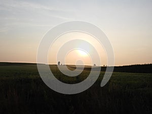 Gentle golden daybreak over Pennsylvania Amish rolling hills farmland