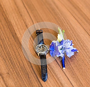 Gentle groom's boutonniere and watch